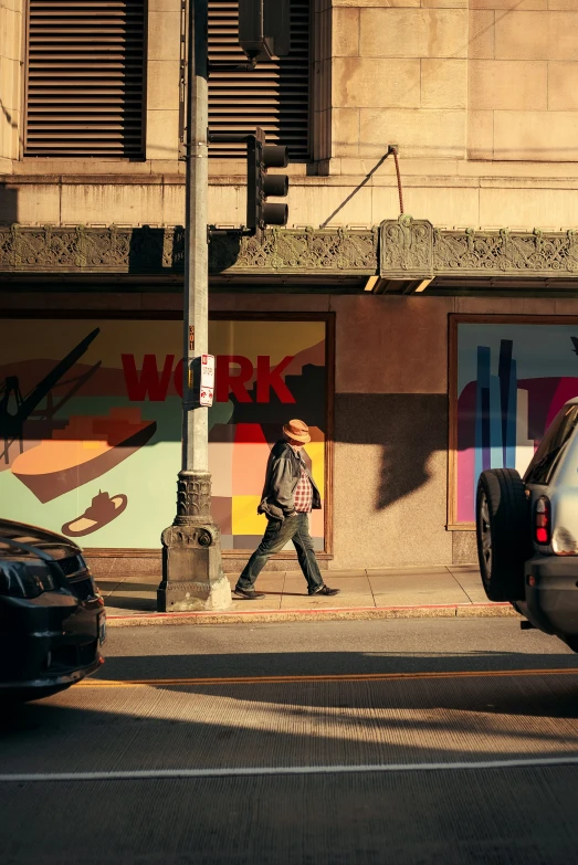 cars and people are walking past a building