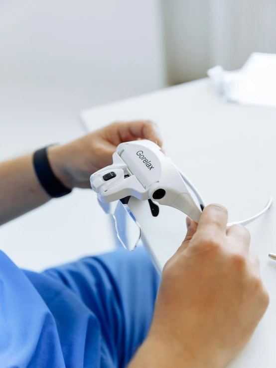 a person is using a cordless video game controller