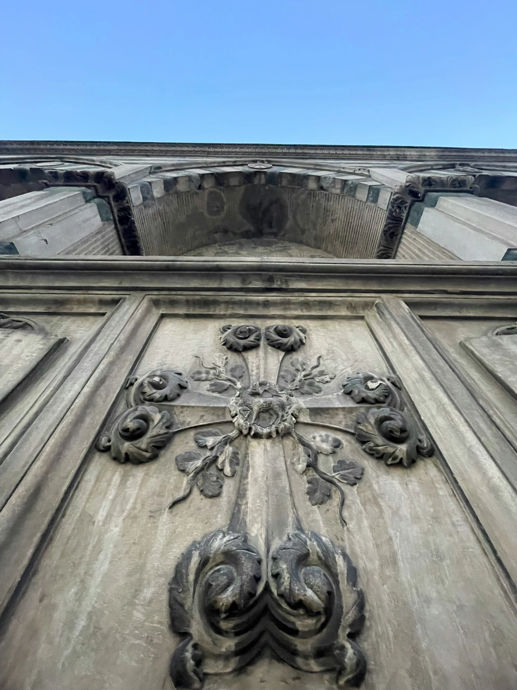 a close up of a decorative stone building with an elaborately carved design