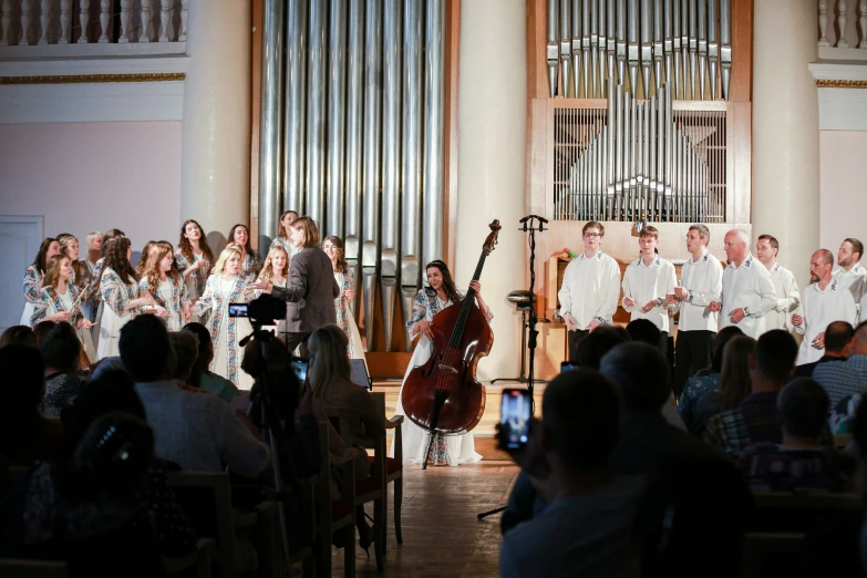 people are playing instruments and singing while the choir sings