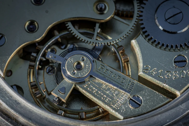 an old clock with a few different gears and numbers