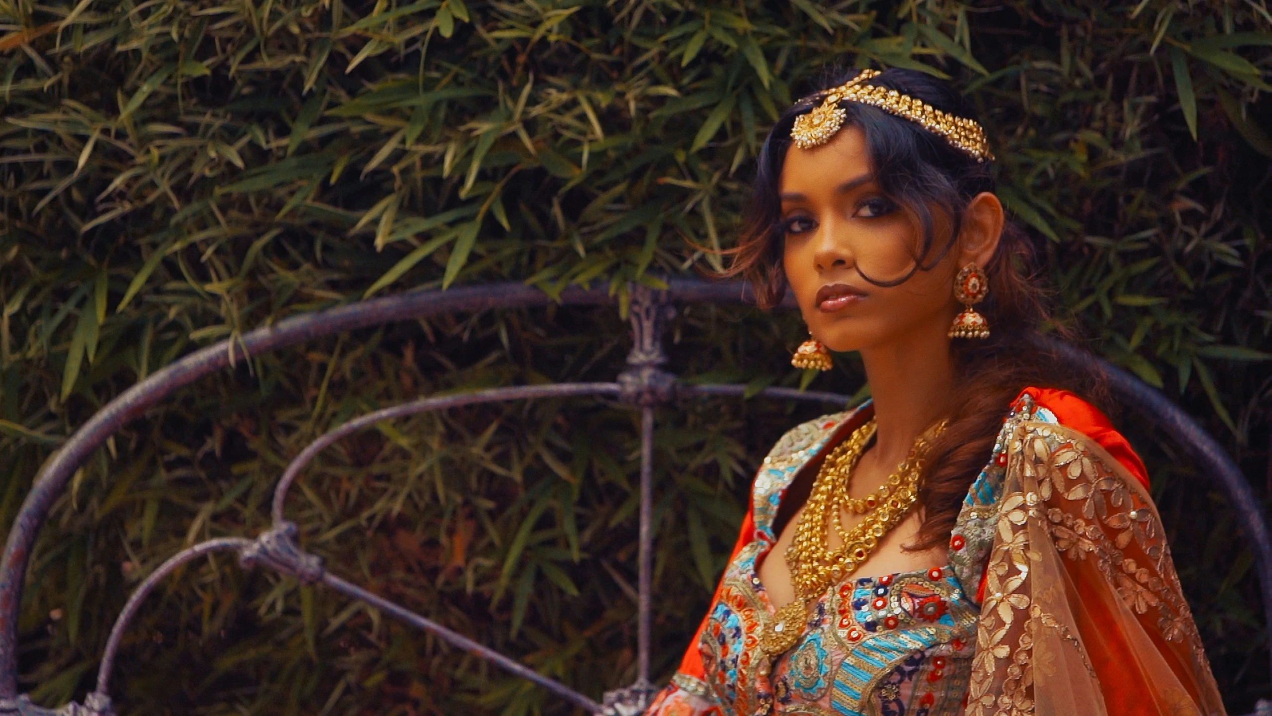 woman with black nose makeup and traditional indian dress