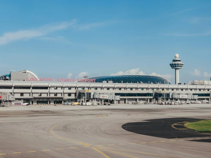 a large airport with an air port in the background