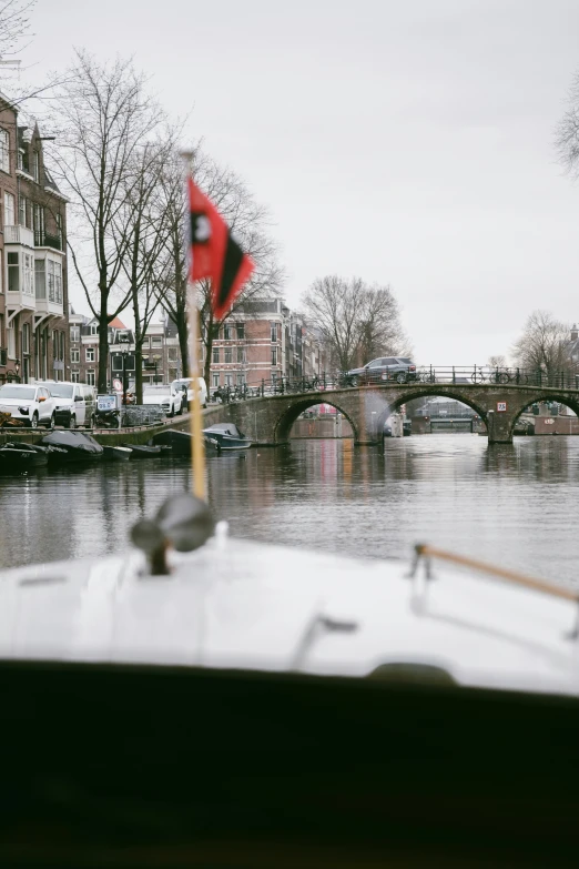 a boat is traveling along the water next to houses