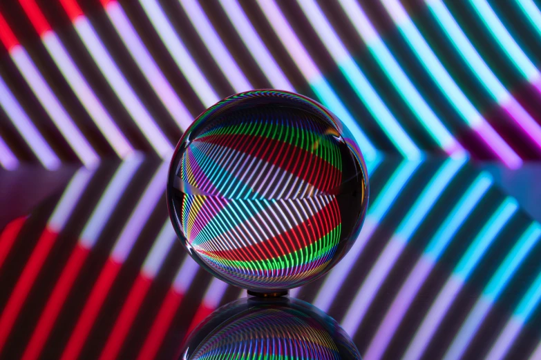 a colorful glass sculpture that looks like it is in motion