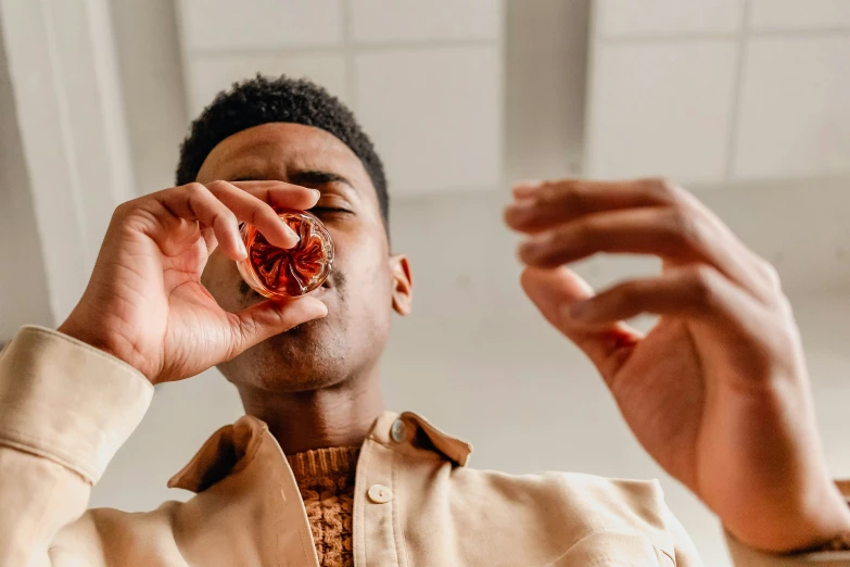 a man holding a heart with a string in his hands