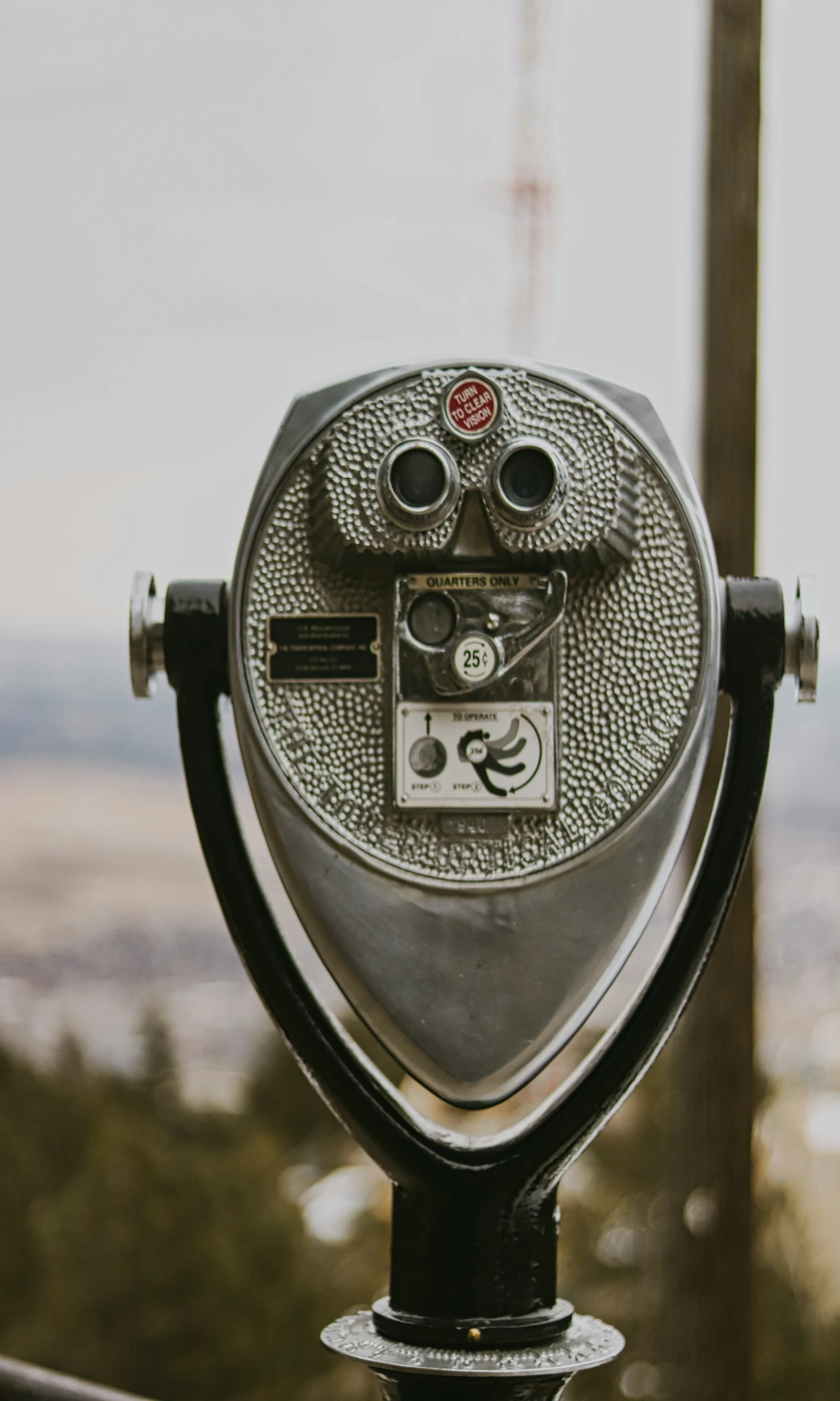 an old coin operated binoculars looking down