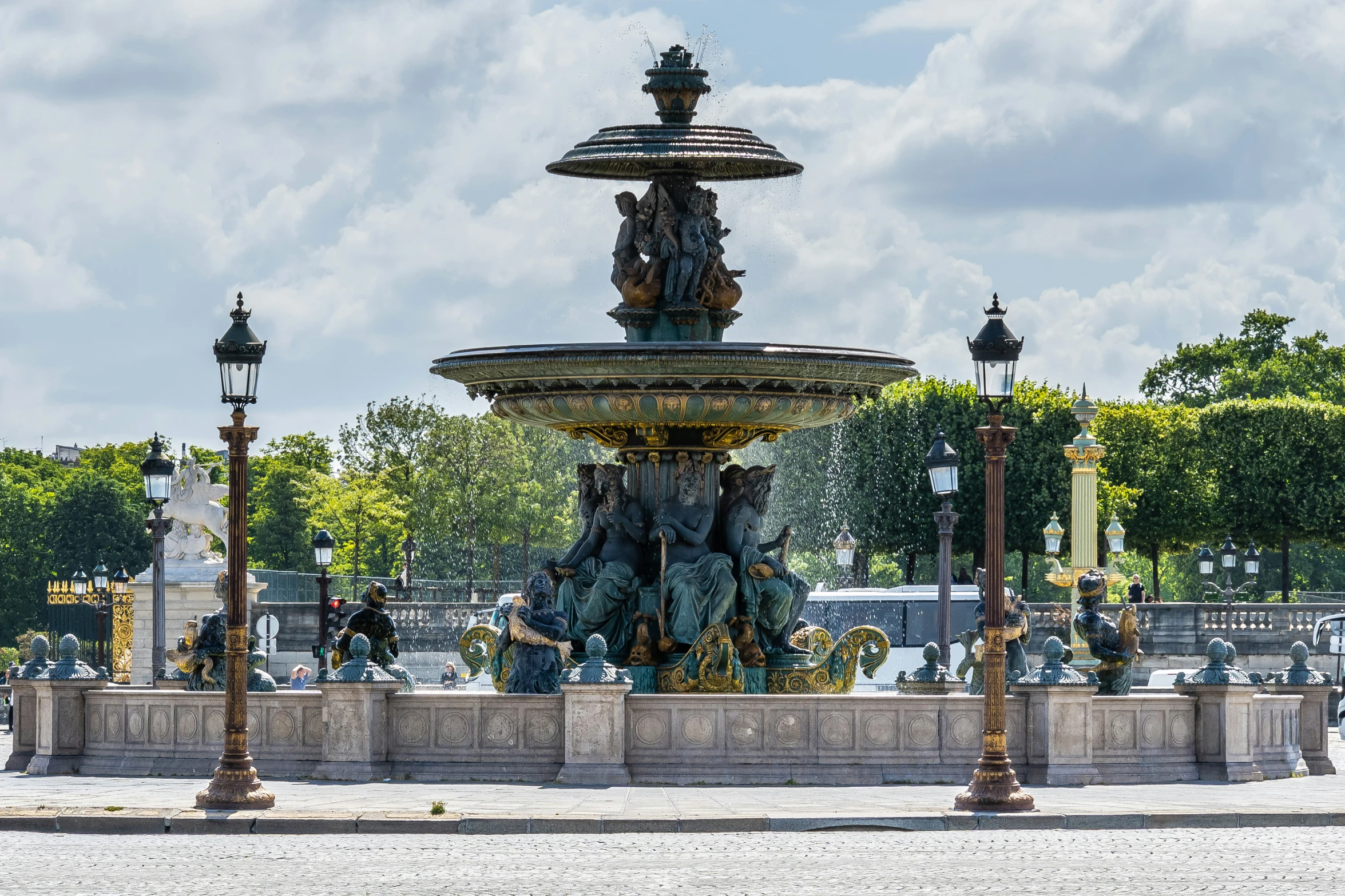 a fountain with a statue on the top of it