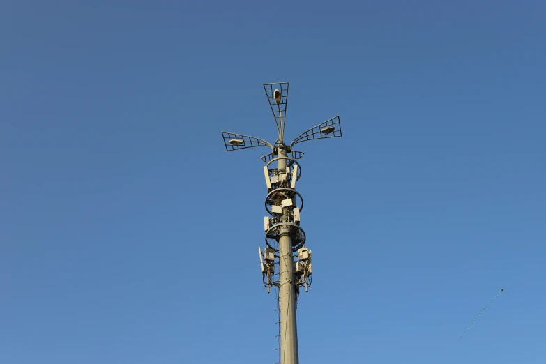 a tower with lots of cables and lots of people