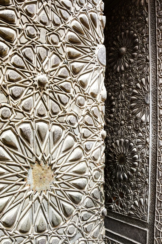 two intricate wall and door panels that are made out of decorative plastic