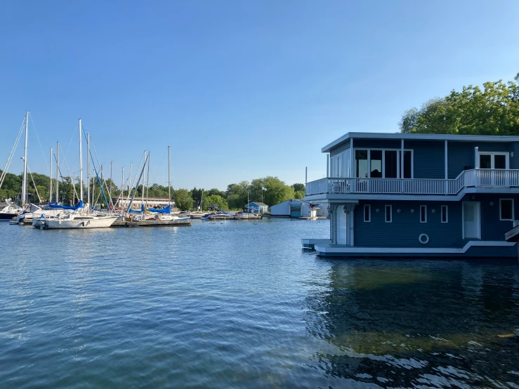 boats are docked in a bay at the edge of the water