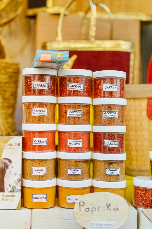 a display table with jars filled with different types of powder