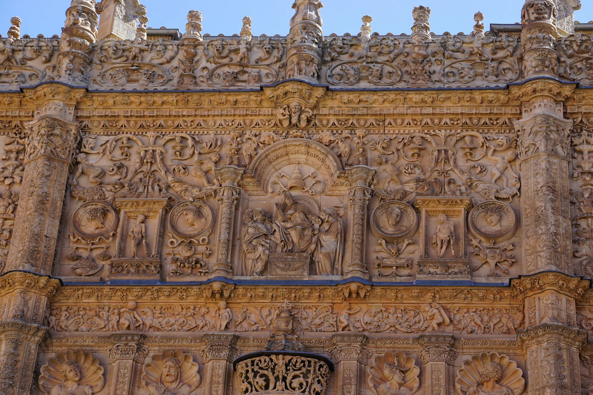 the old ornate building has carved figures on it