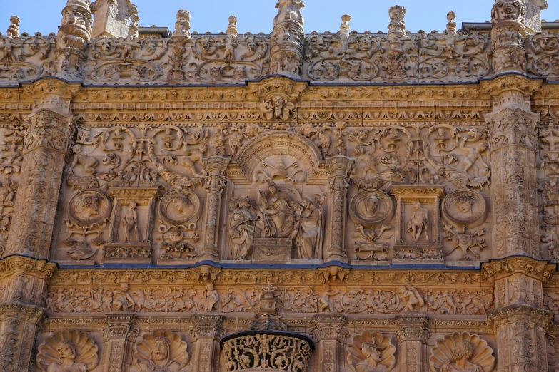 the old ornate building has carved figures on it