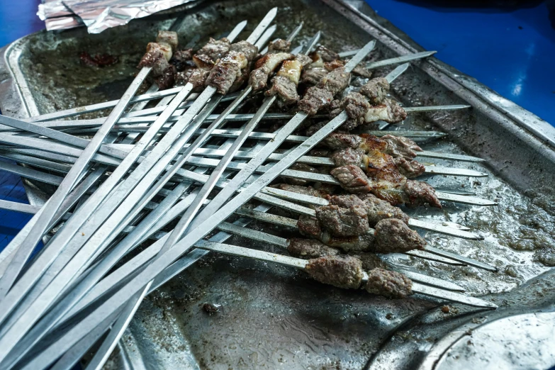 this is an image of barbecue skewers in aluminumware