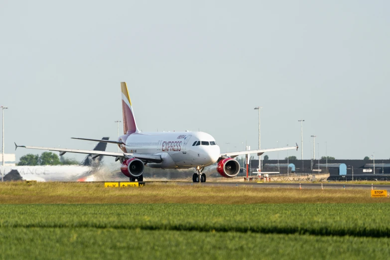 a large commercial airplane takes off from the runway