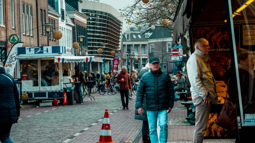 a man walking down the street in the daytime