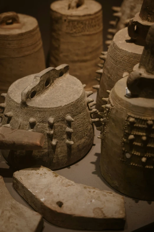 pottery with wooden handles and various items in front of it