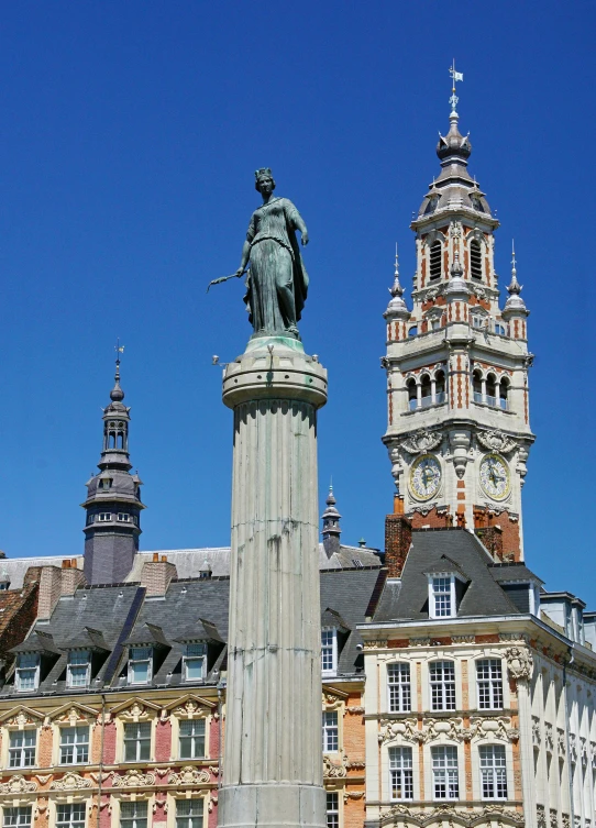 a statue is in front of two buildings