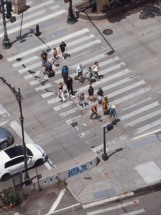 a busy city street intersection with people walking and walking