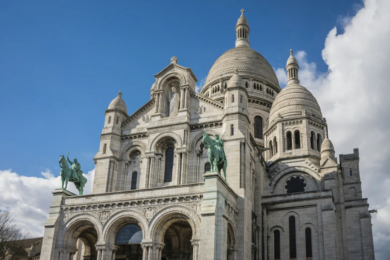 the large cathedral has many statues on the windows