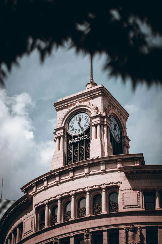 an ornate clock tower on top of a building