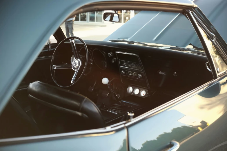 the inside of a car that is showing the dashboard and steering wheel