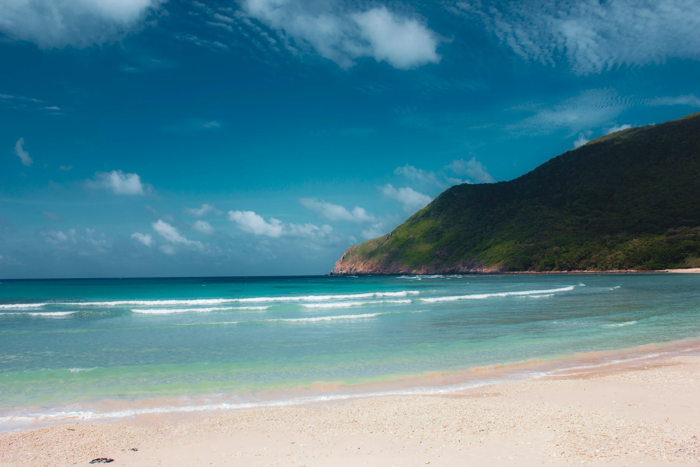 the sand on a beach has an ocean view