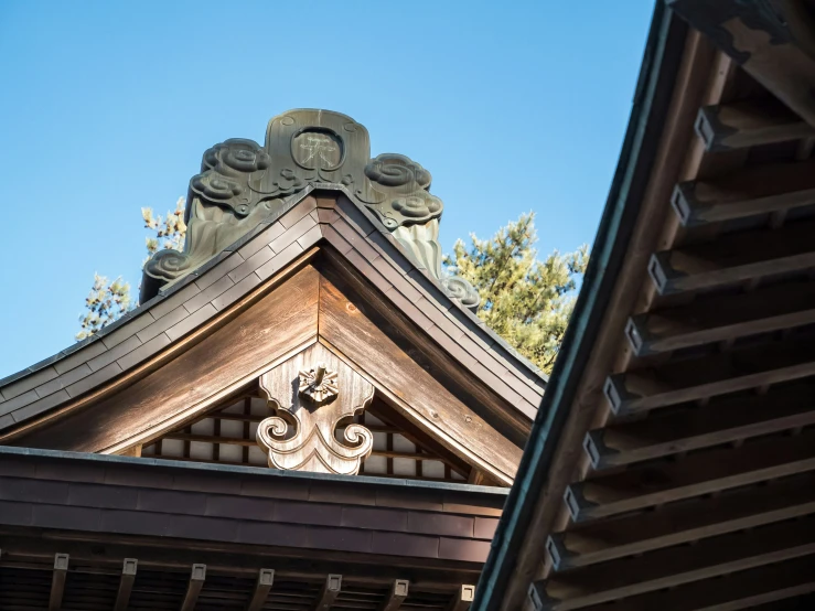 a brown building with a roof made of clay