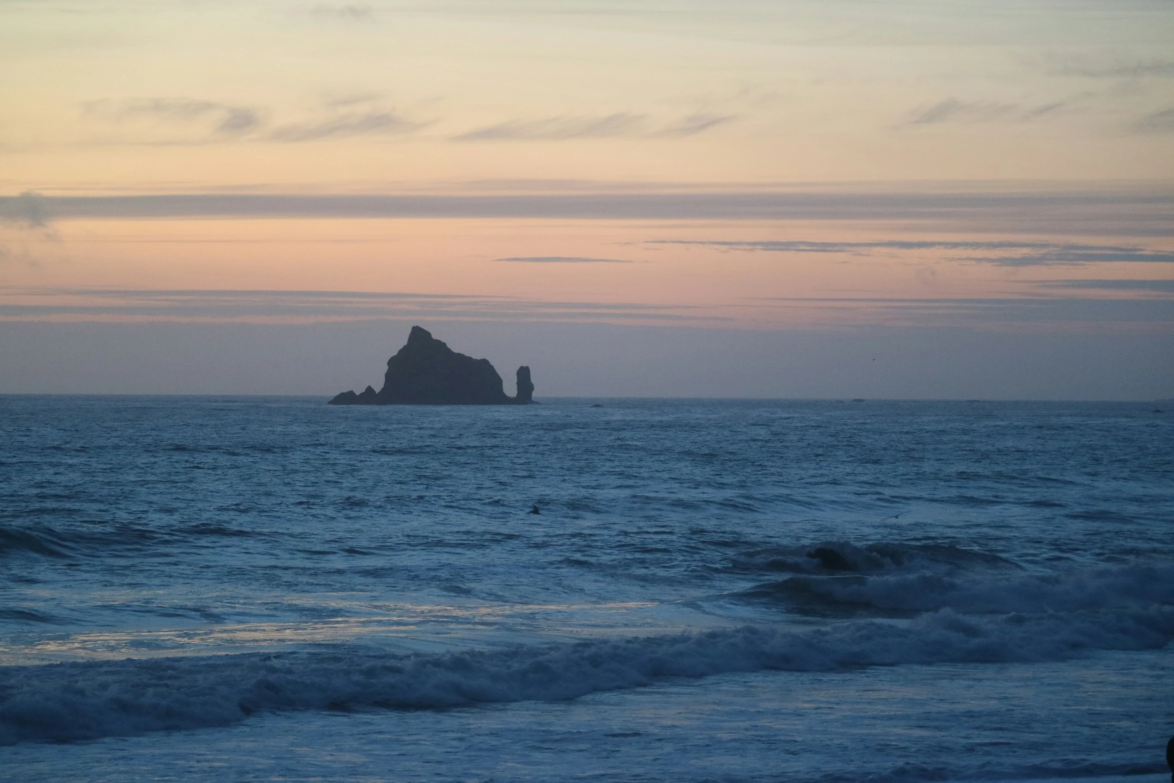 the view of an island from the ocean