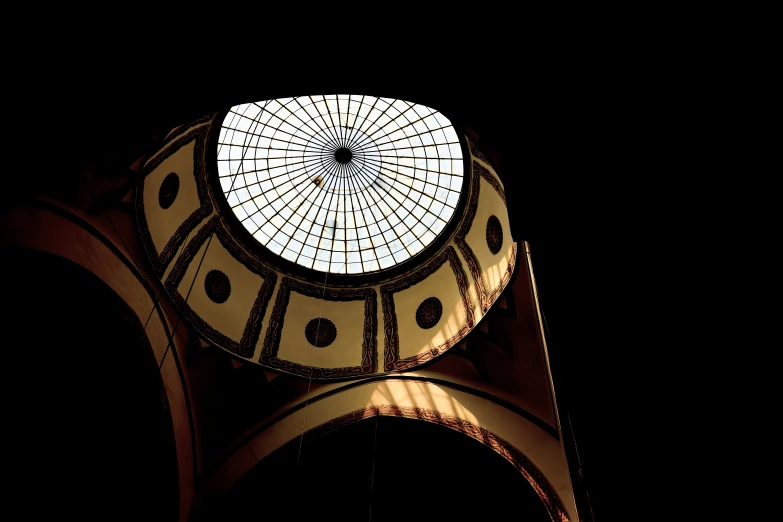 a very tall building that has a glass roof