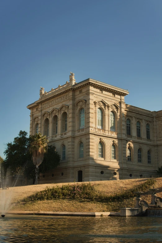 the large house is on the edge of the water