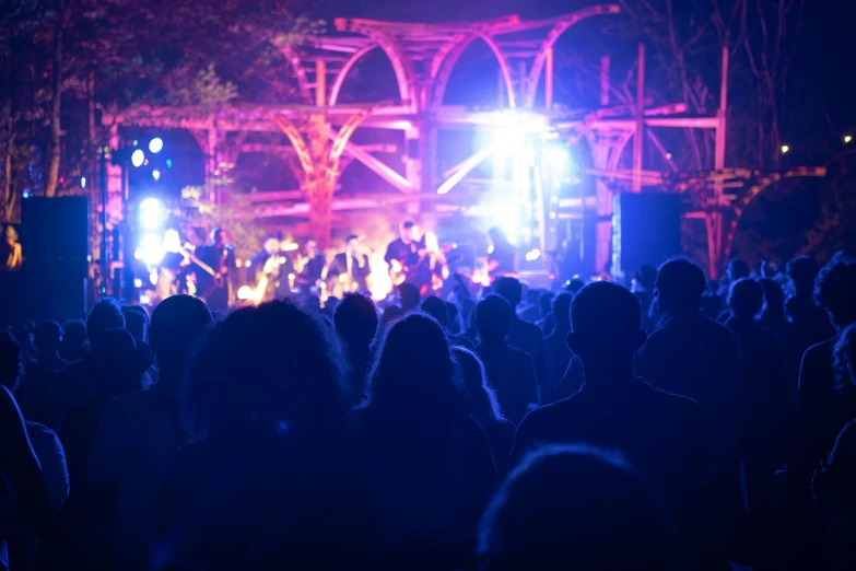 an image of a stage set at night with light and people