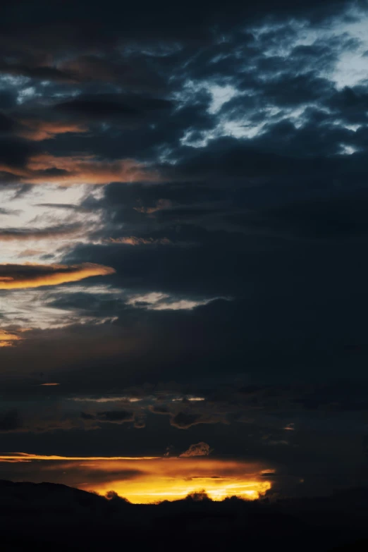 some dark clouds with some light reflecting from them