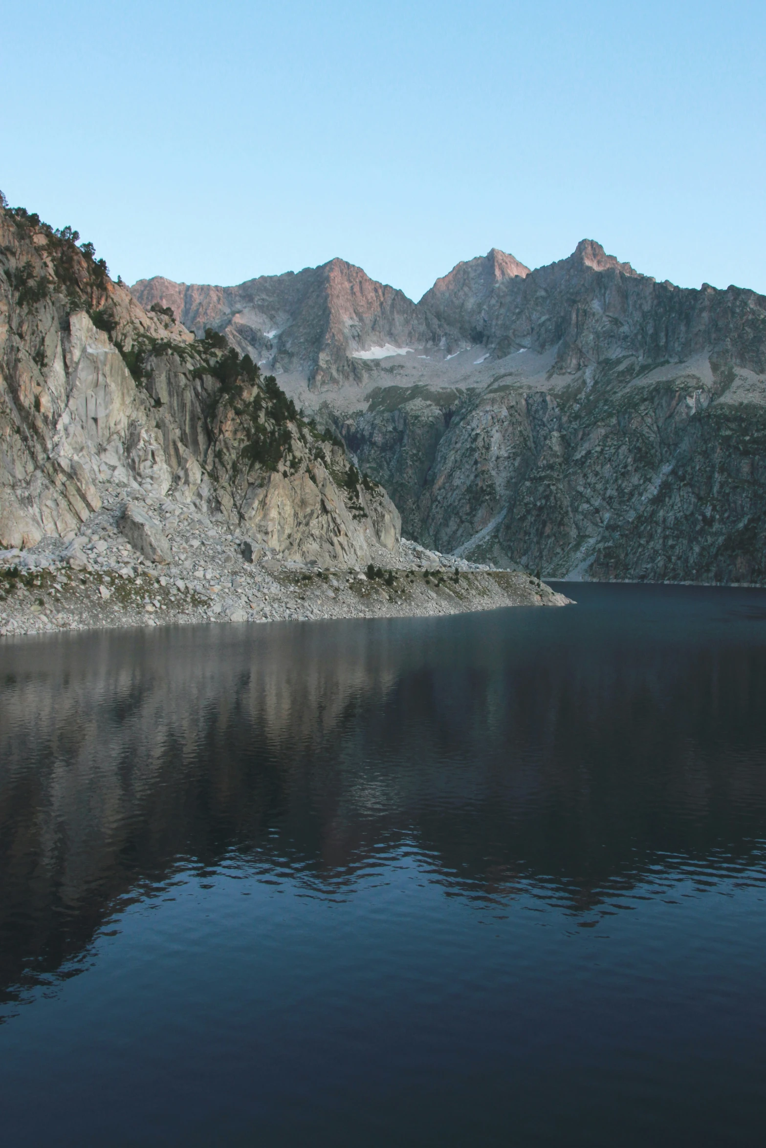 some water and some mountains that are side by side