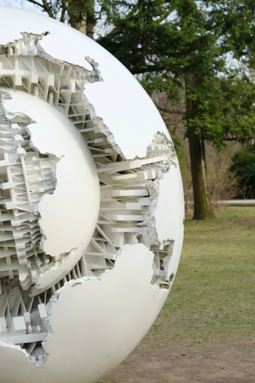 an outdoor sculpture that is looking like a world