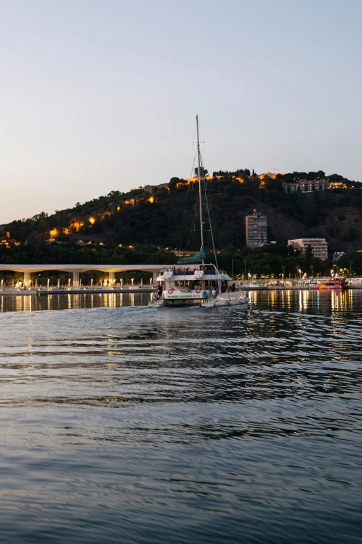 a boat is sailing down a river next to a shore