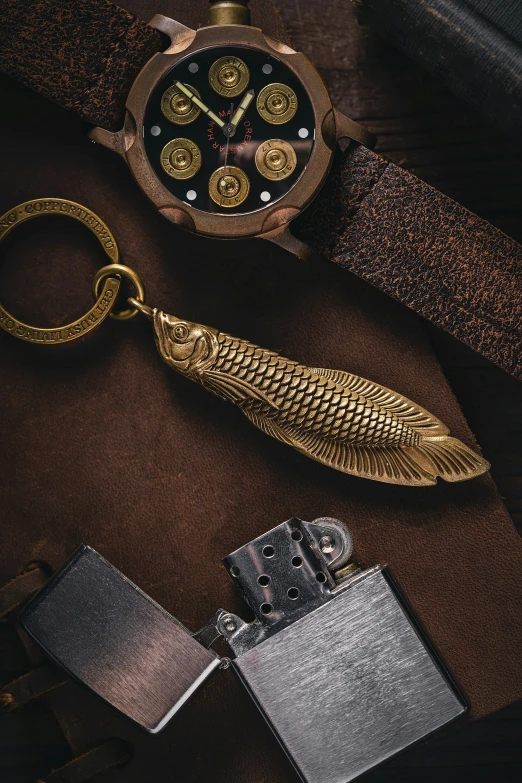 a gold wrist watch sitting on top of leather