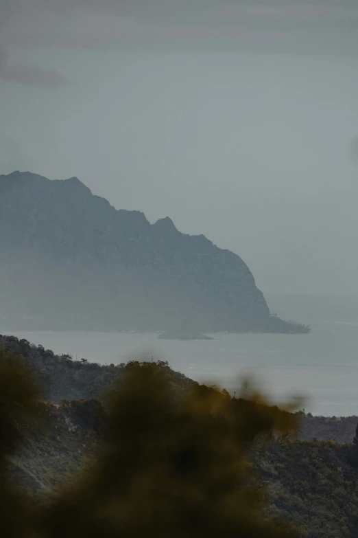 a plane flies high in the air over an island