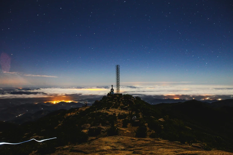 a very long tower on a big hill