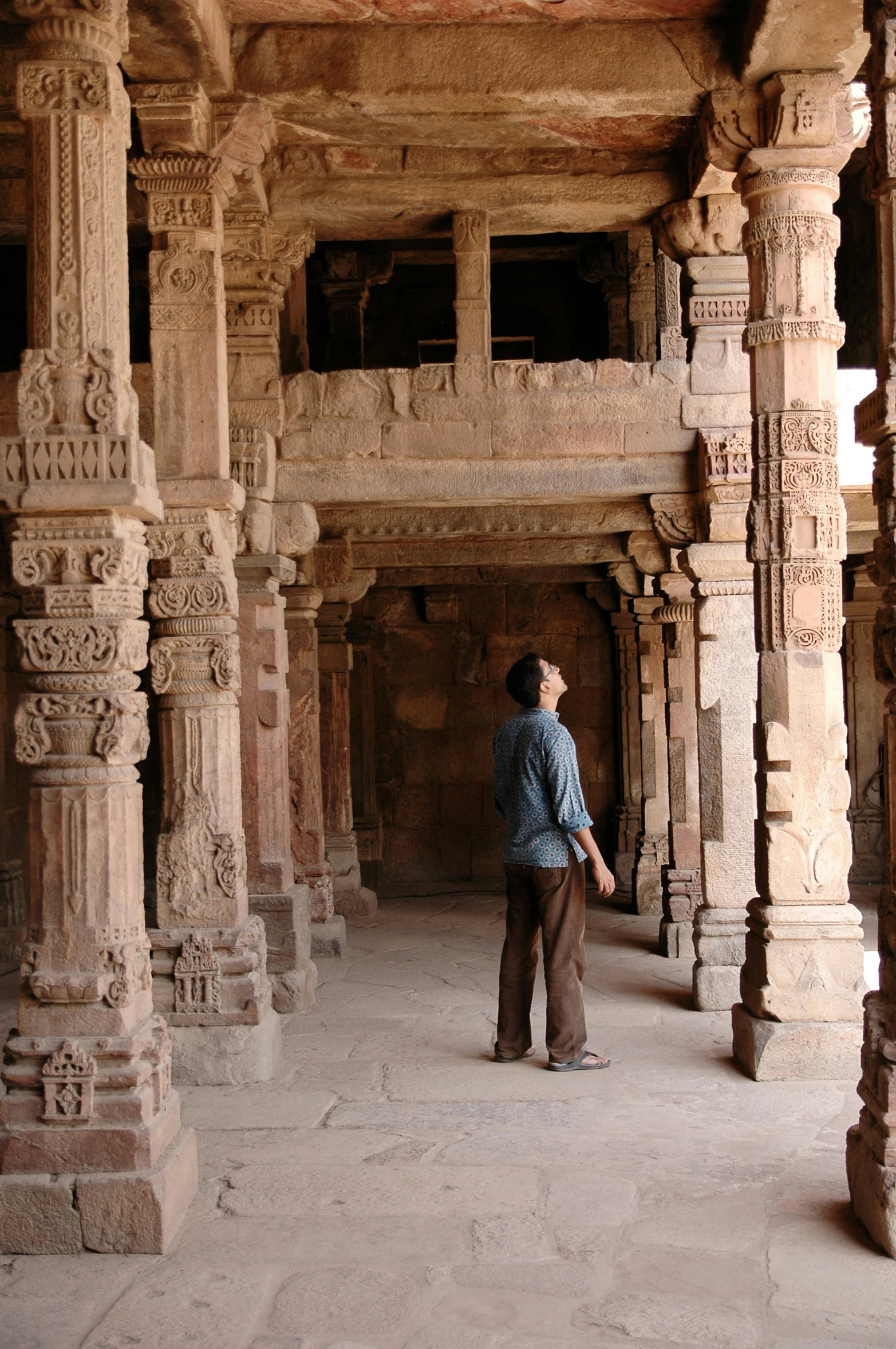 the inside of an ornate building with pillars and carvings