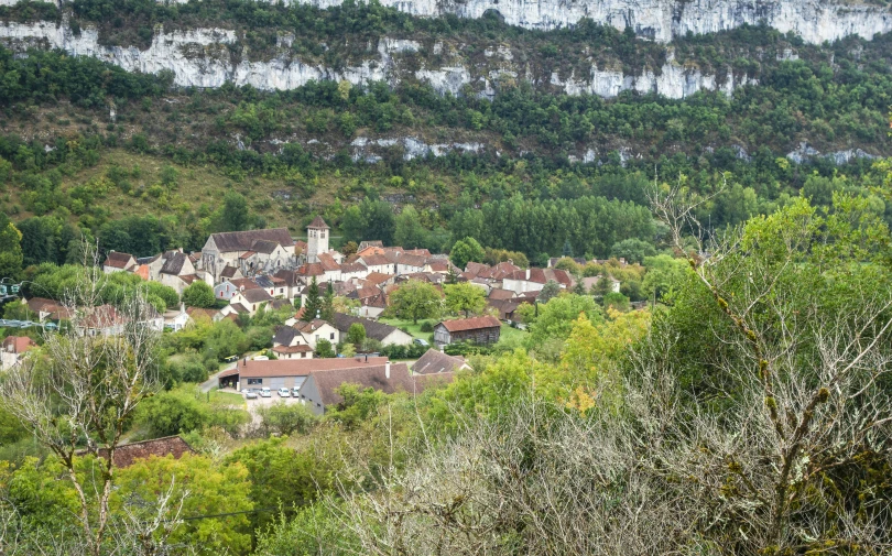 a very tall hill that has some houses on top of it