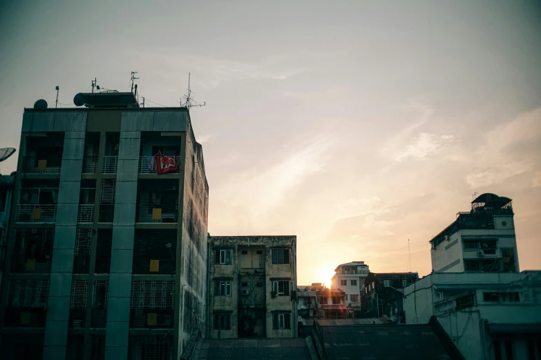 a tall building near a building with a radio on top of it