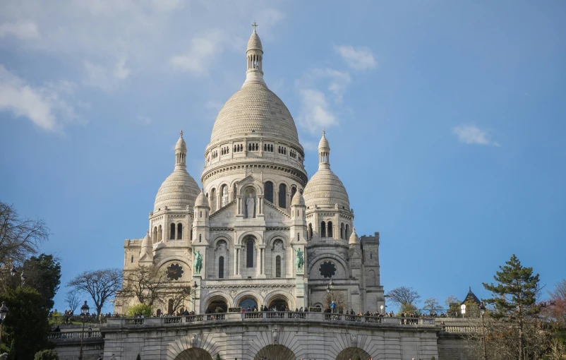 a very tall white building with some spires