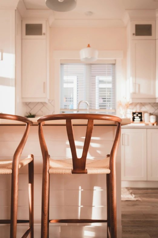 a close up of two chairs near a counter top