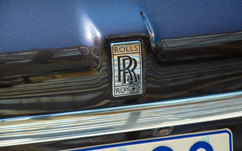 closeup of a rolls royce logo on a car