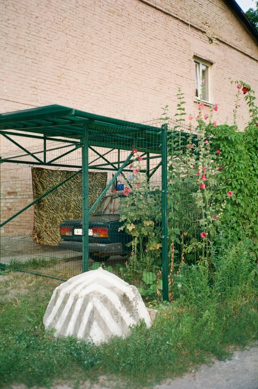 this is a green cover to protect the cars from the sun