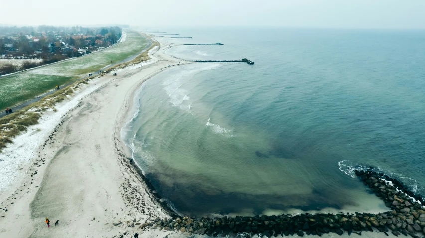 an aerial view of a sandy beach and coast line