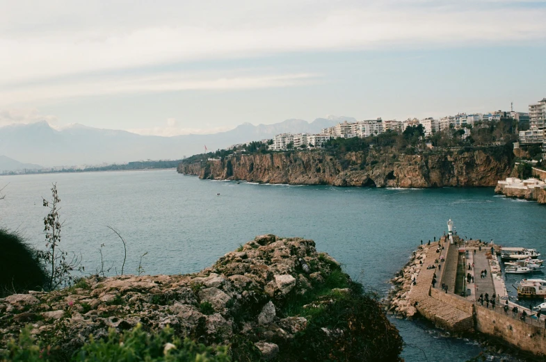 a wide body of water surrounded by a city