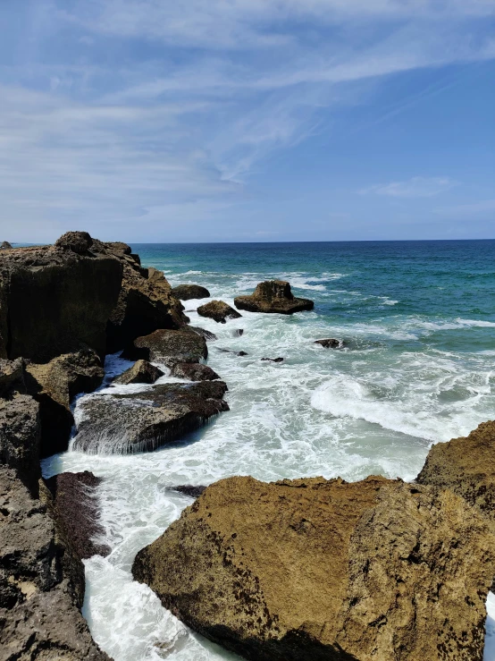 water flowing over rocks near a beach